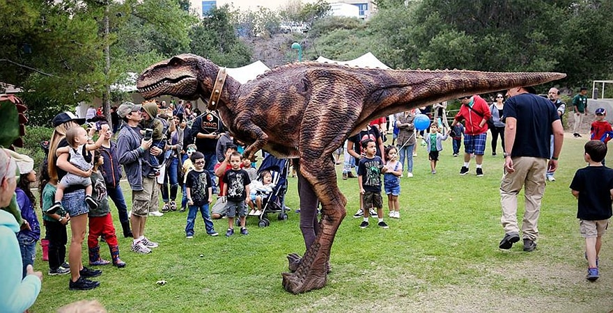 Jurassic Scenes Reimagined with Dinosaur Costumes