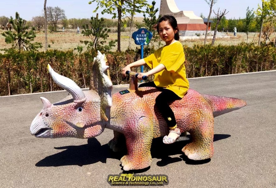 Dinosaur Electric Car in playground