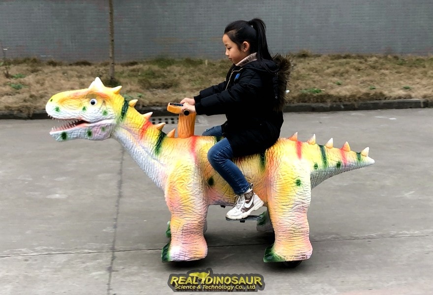 amusement pakr dinosaur car
